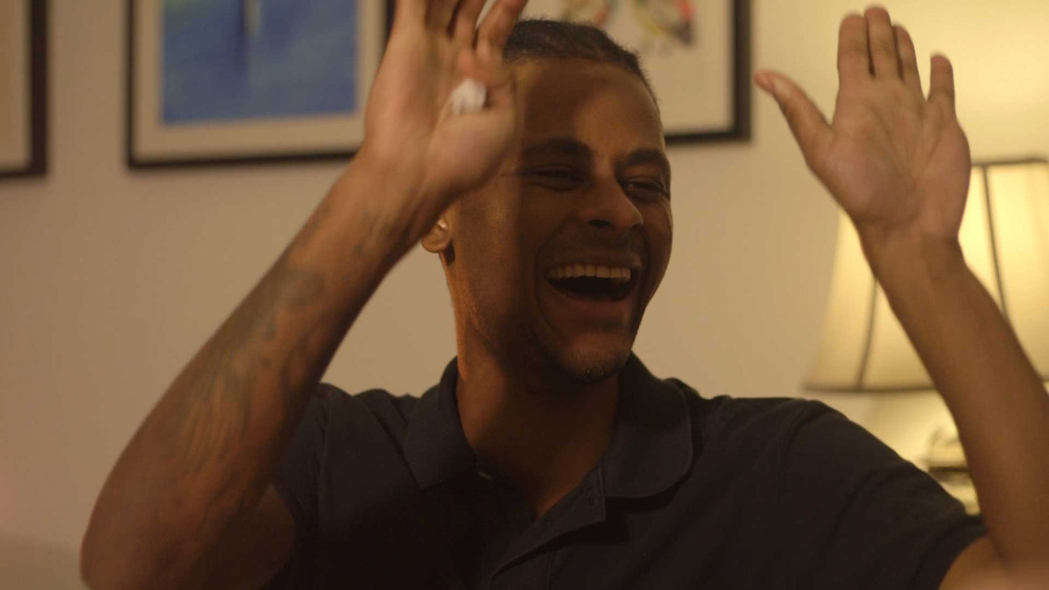 Man high fives and laughs