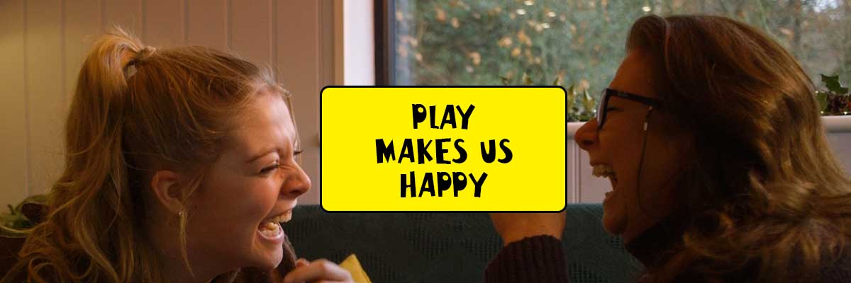 Play makes us happy. Mother and daughter laugh together